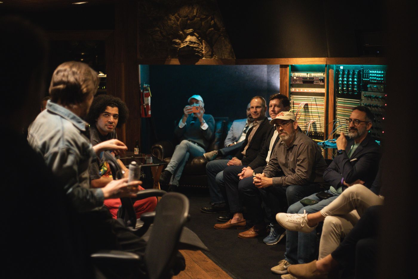 A host welcoming a corporate group in the Paramount live room