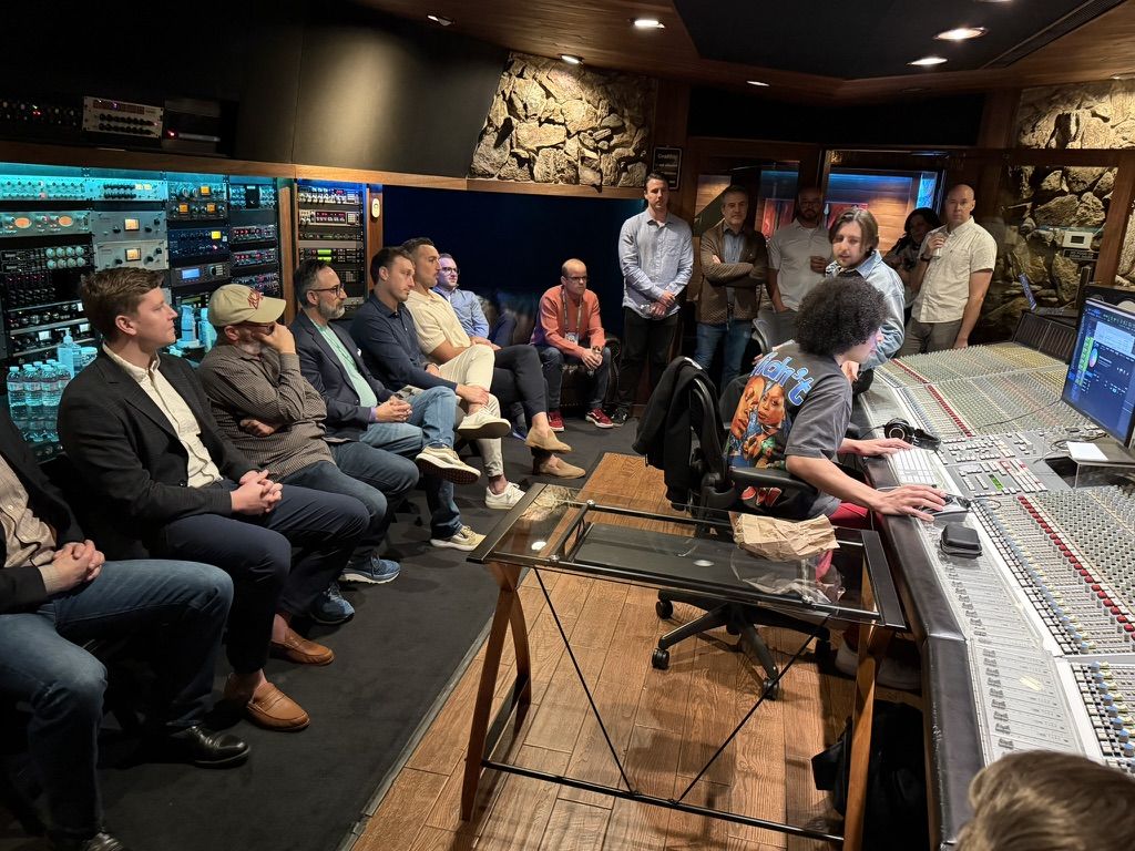 Group with an engineer in the control room